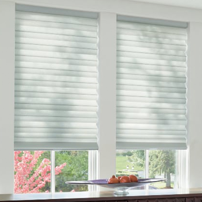 White shades in a kitchen.