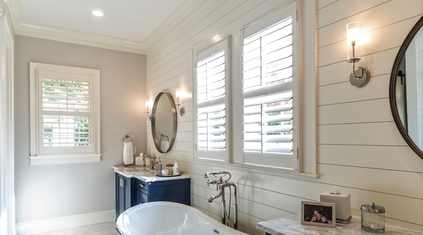 Honolulu bathroom with white plantation shutters.