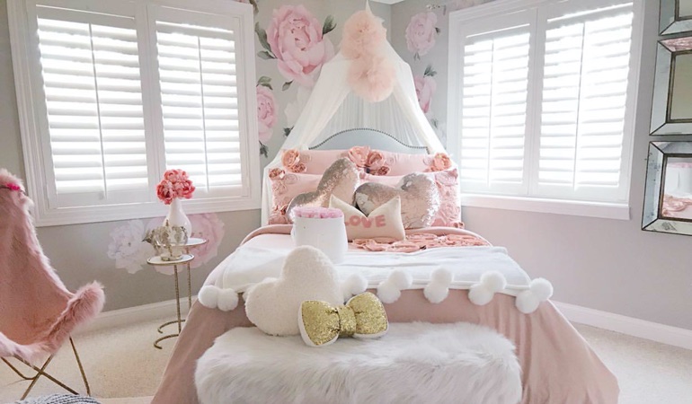 Plantation shutters can add some charm to your kid’s bedroom. Plantation shutters in a girls bedroom
