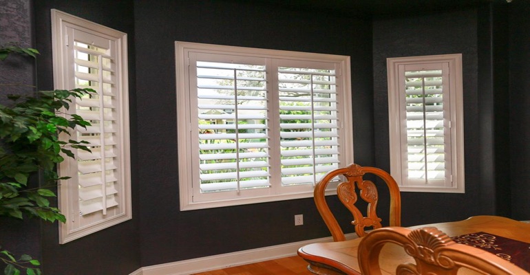 Beautiful Plantation Shutters In Dark Green Dining Room