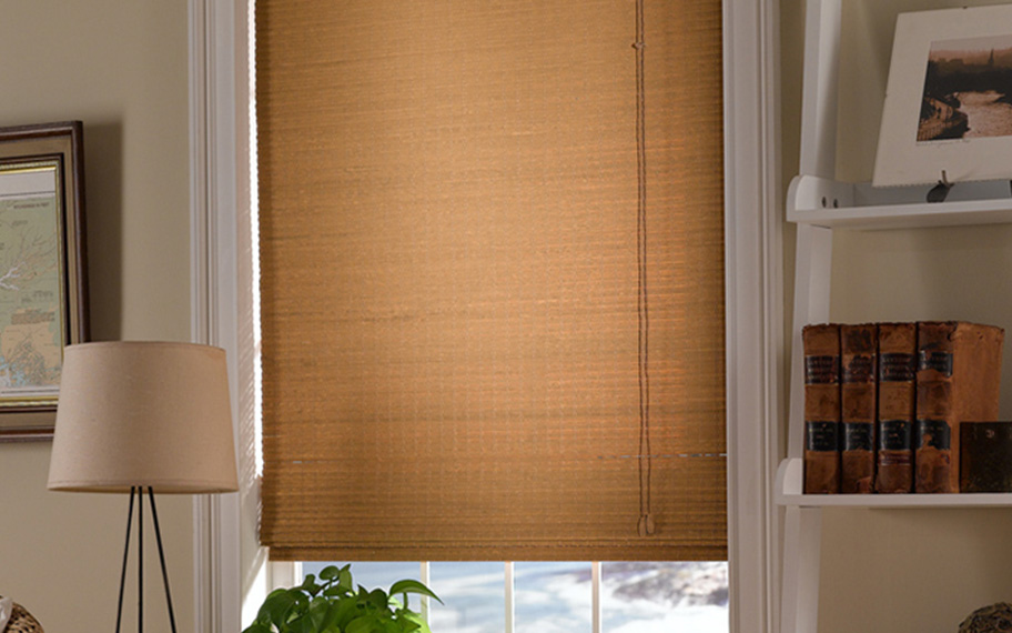 Add a touch of nature to your decor with woven fiber shades in Honolulu. Tan woven fiber shades in a living room